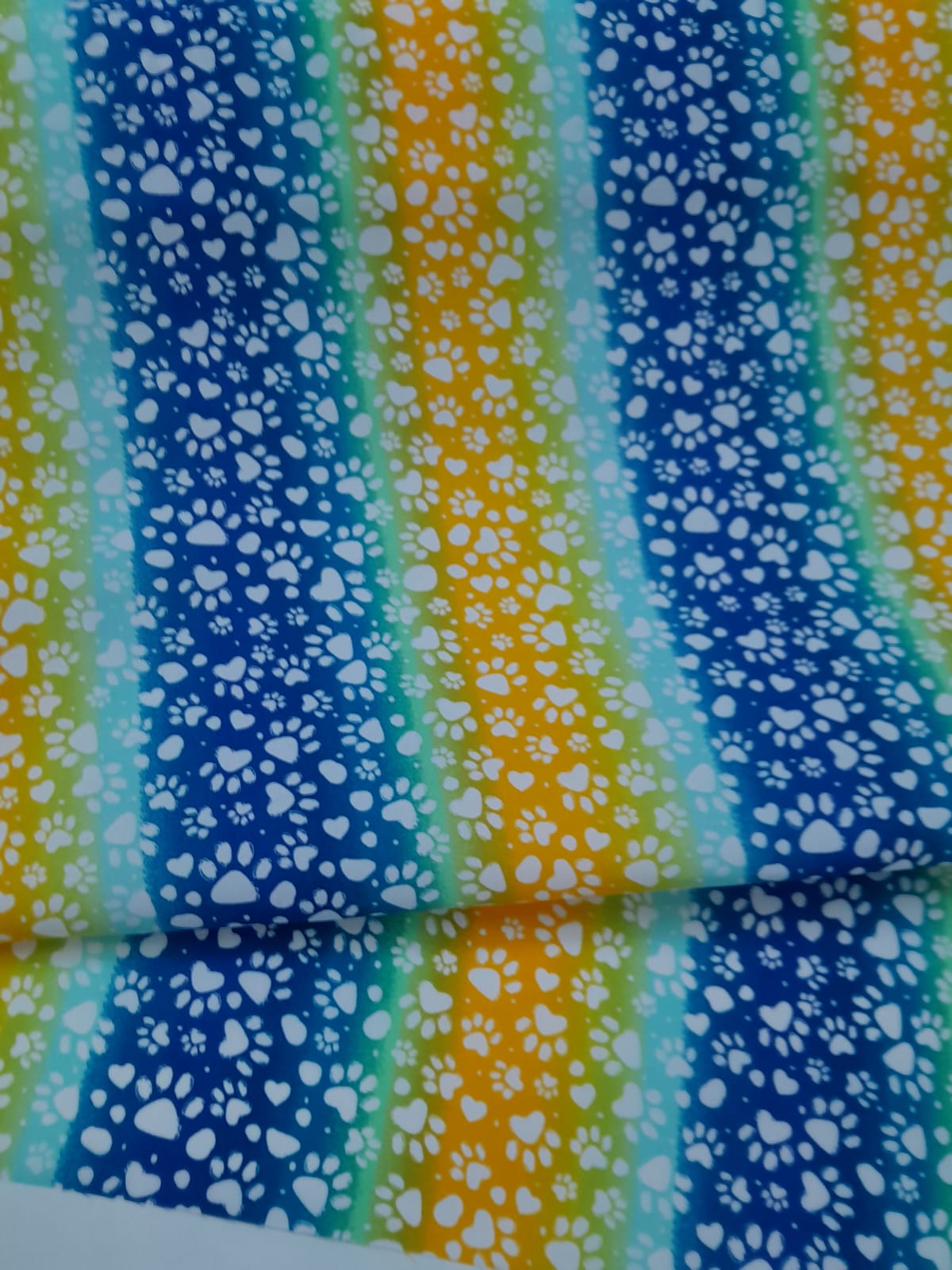 imagen de Lona huellas multicolor