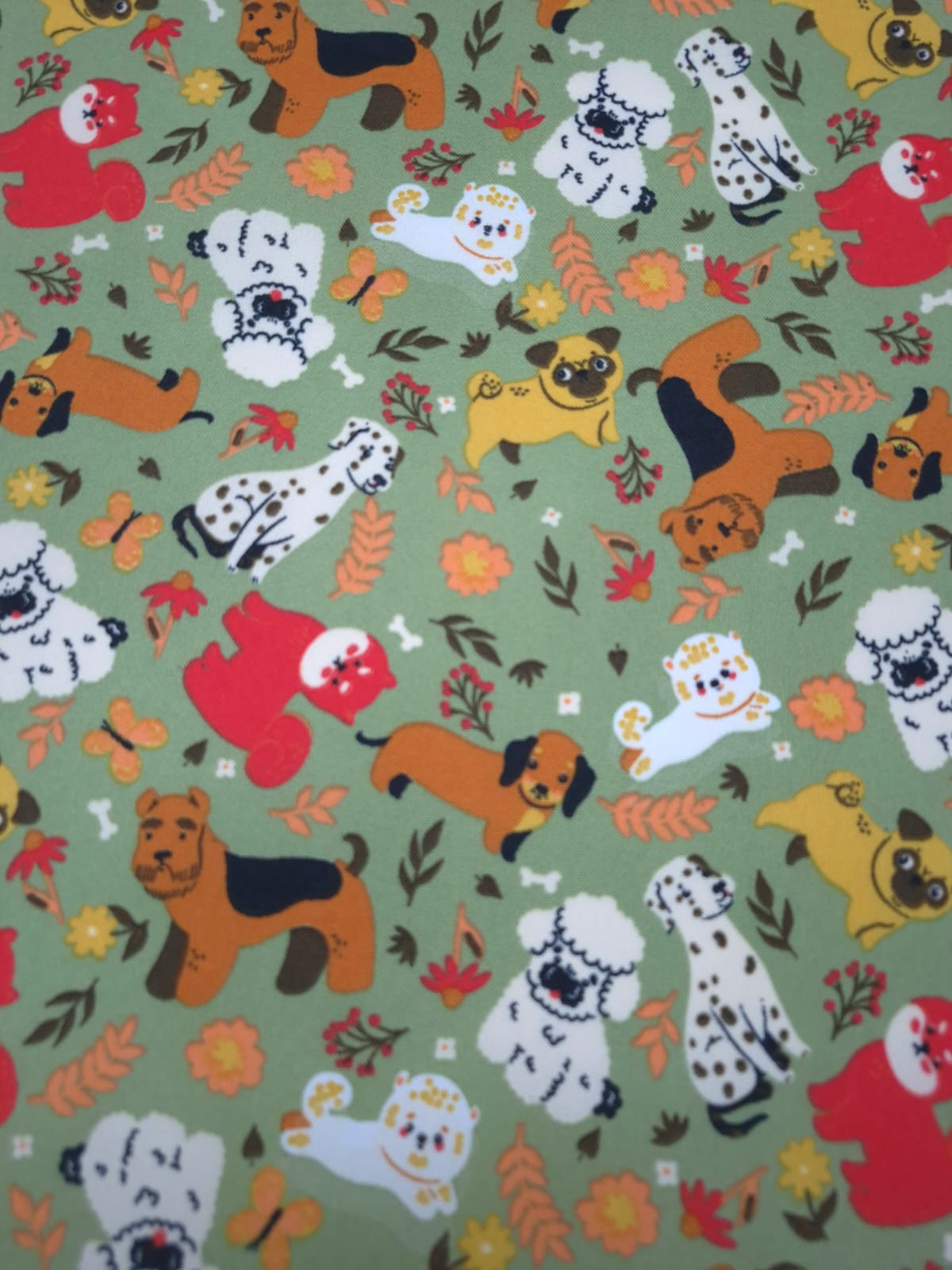 imagen de Lona estampada perritos fondo verde